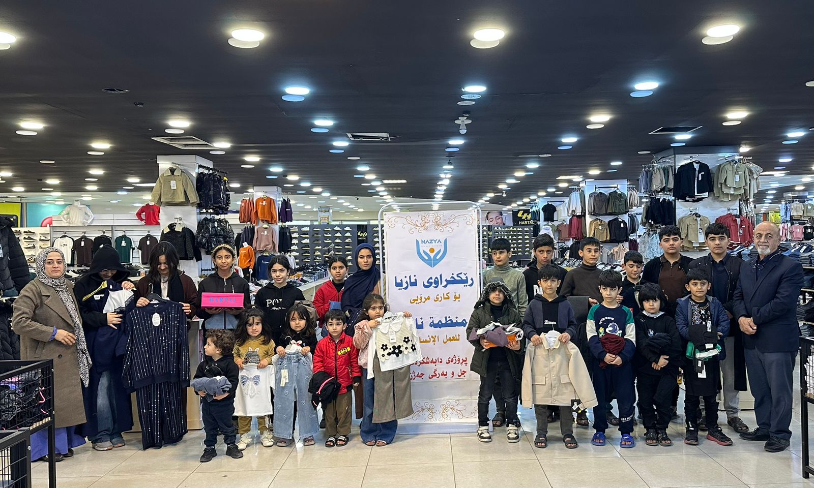 Nazya Humanitarian Aid distributing Eid clothes and gifts to children and families in need in Kurdistan