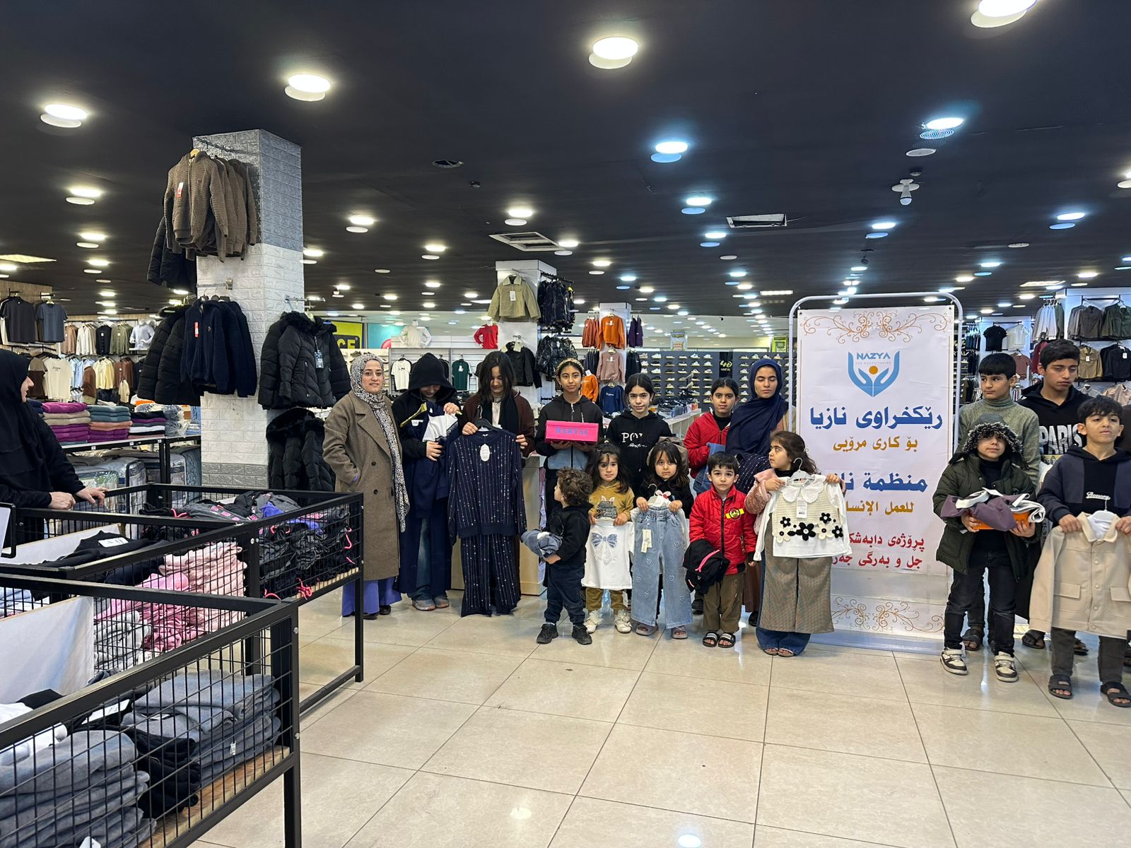 Nazya Humanitarian Aid distributing Eid clothes and gifts to children and families in need in Kurdistan