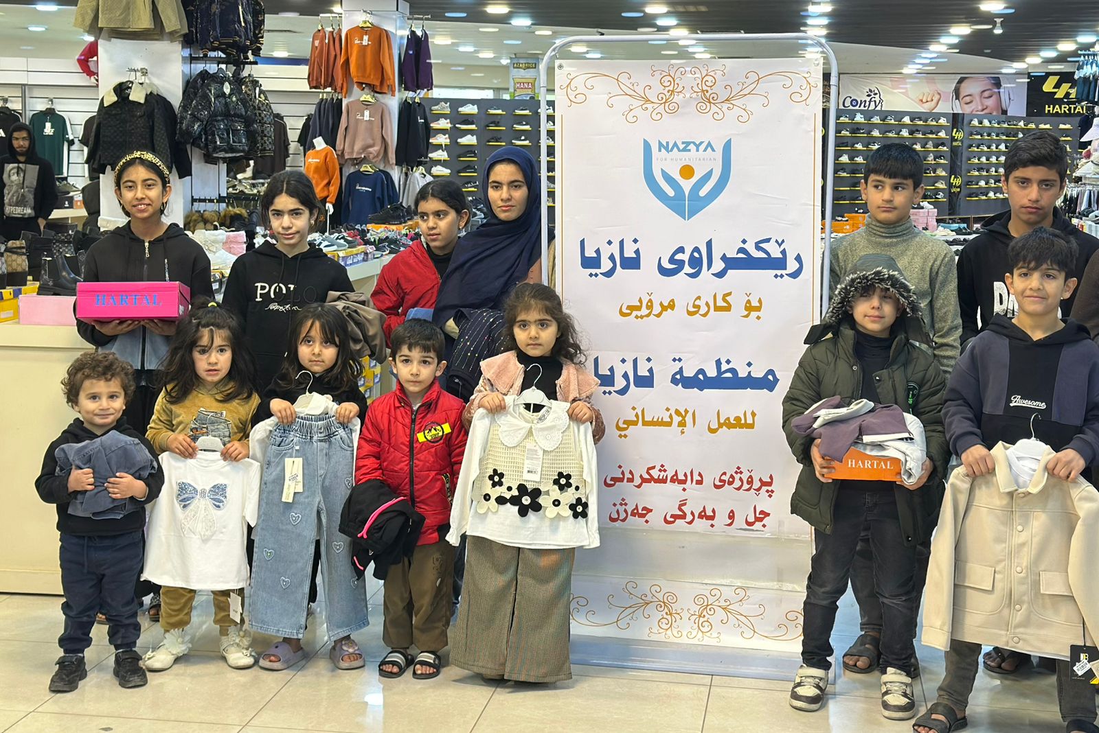 Nazya Humanitarian Aid distributing Eid clothes and gifts to children and families in need in Kurdistan
