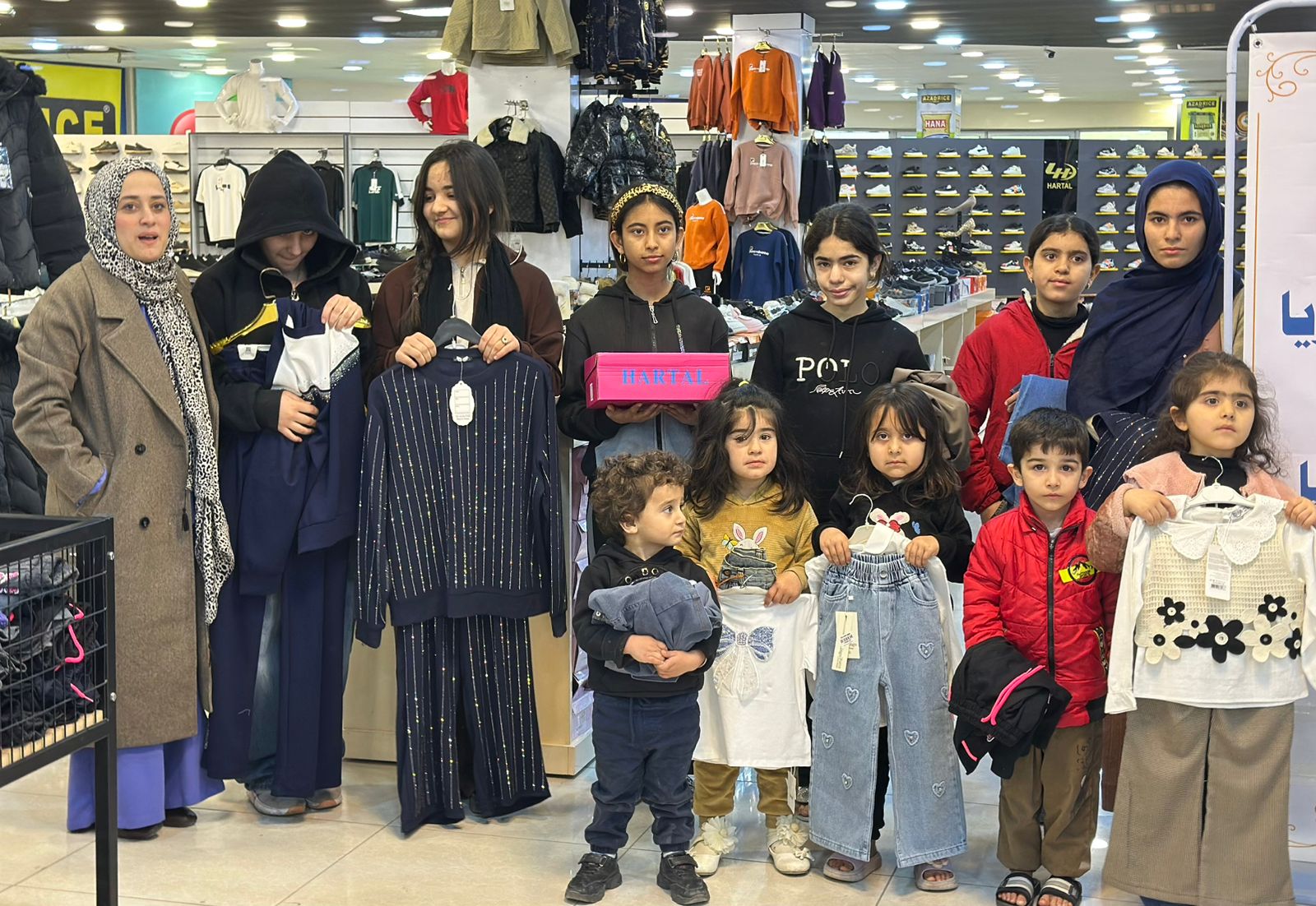 Nazya Humanitarian Aid distributing Eid clothes and gifts to children and families in need in Kurdistan