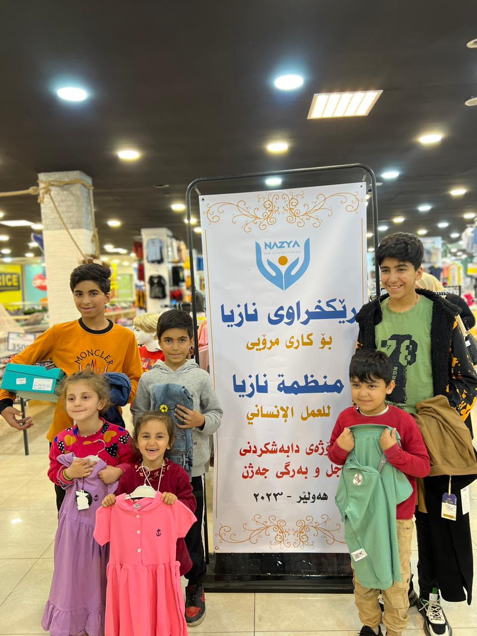Nazya Humanitarian Aid distributing Eid clothes and gifts to children and families in need in Kurdistan