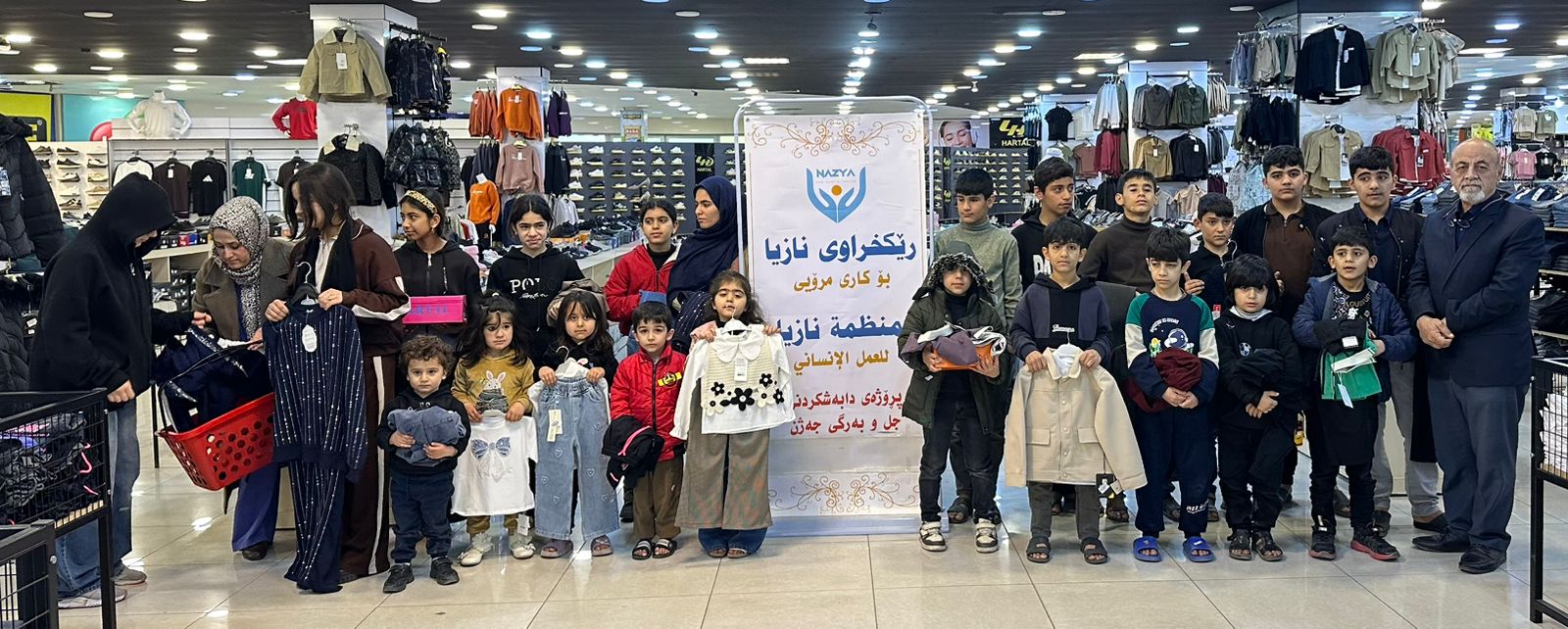 Nazya Humanitarian Aid distributing Eid clothes and gifts to children and families in need in Kurdistan