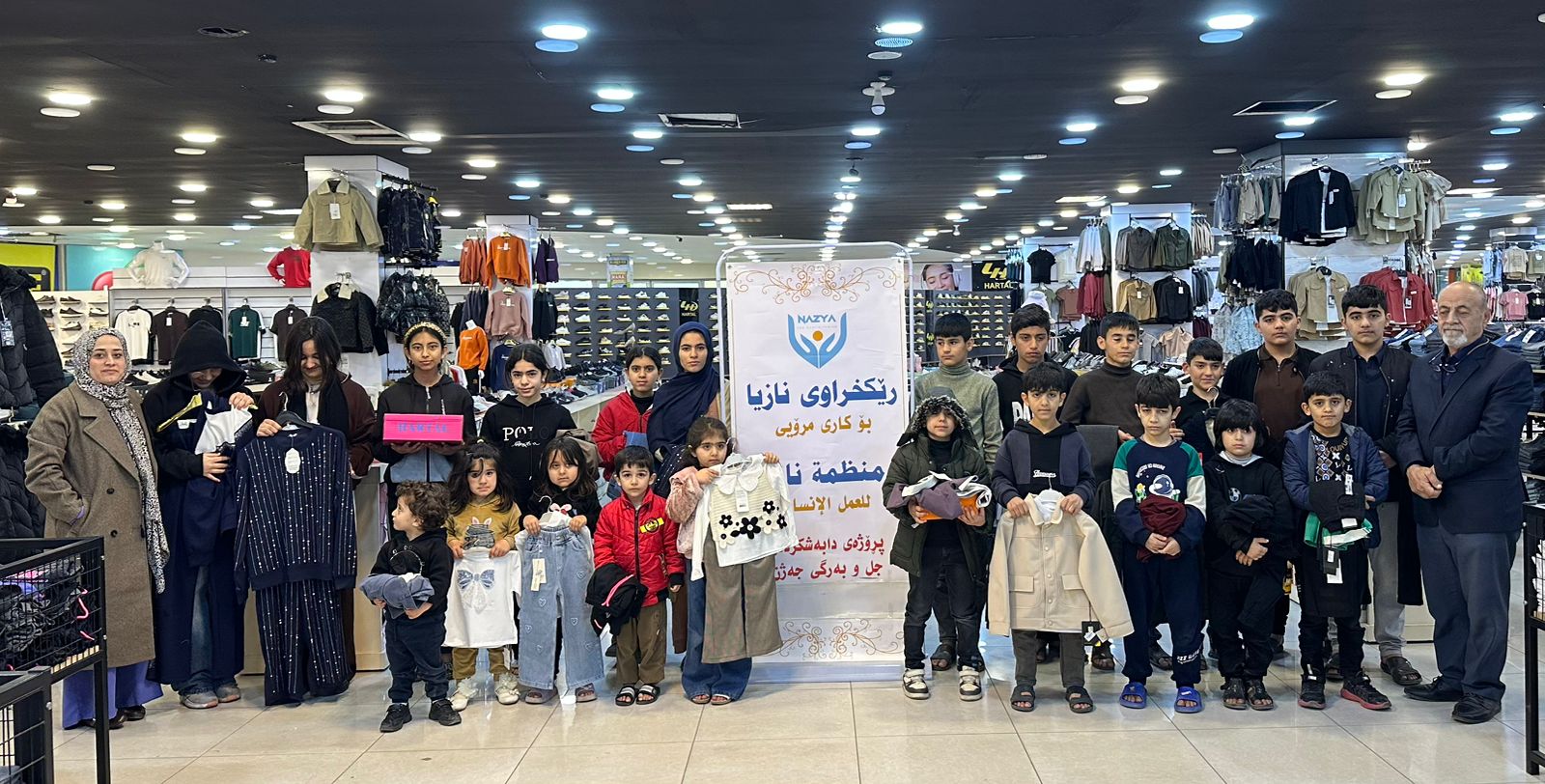 Nazya Humanitarian Aid distributing Eid clothes and gifts to children and families in need in Kurdistan