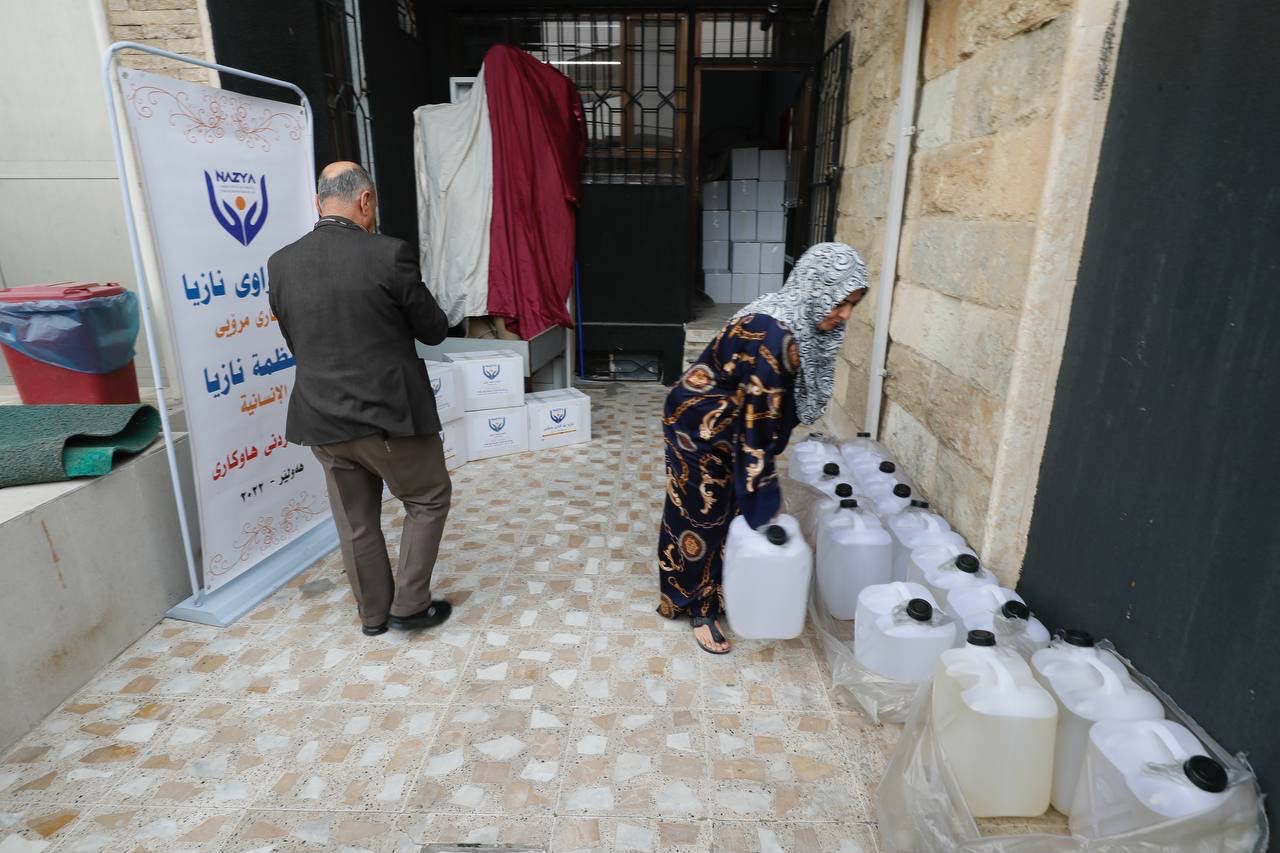 Nazya Humanitarian Aid distributing heating oil (kerosene) to families for heaters (zopa) during winter in Kurdistan
