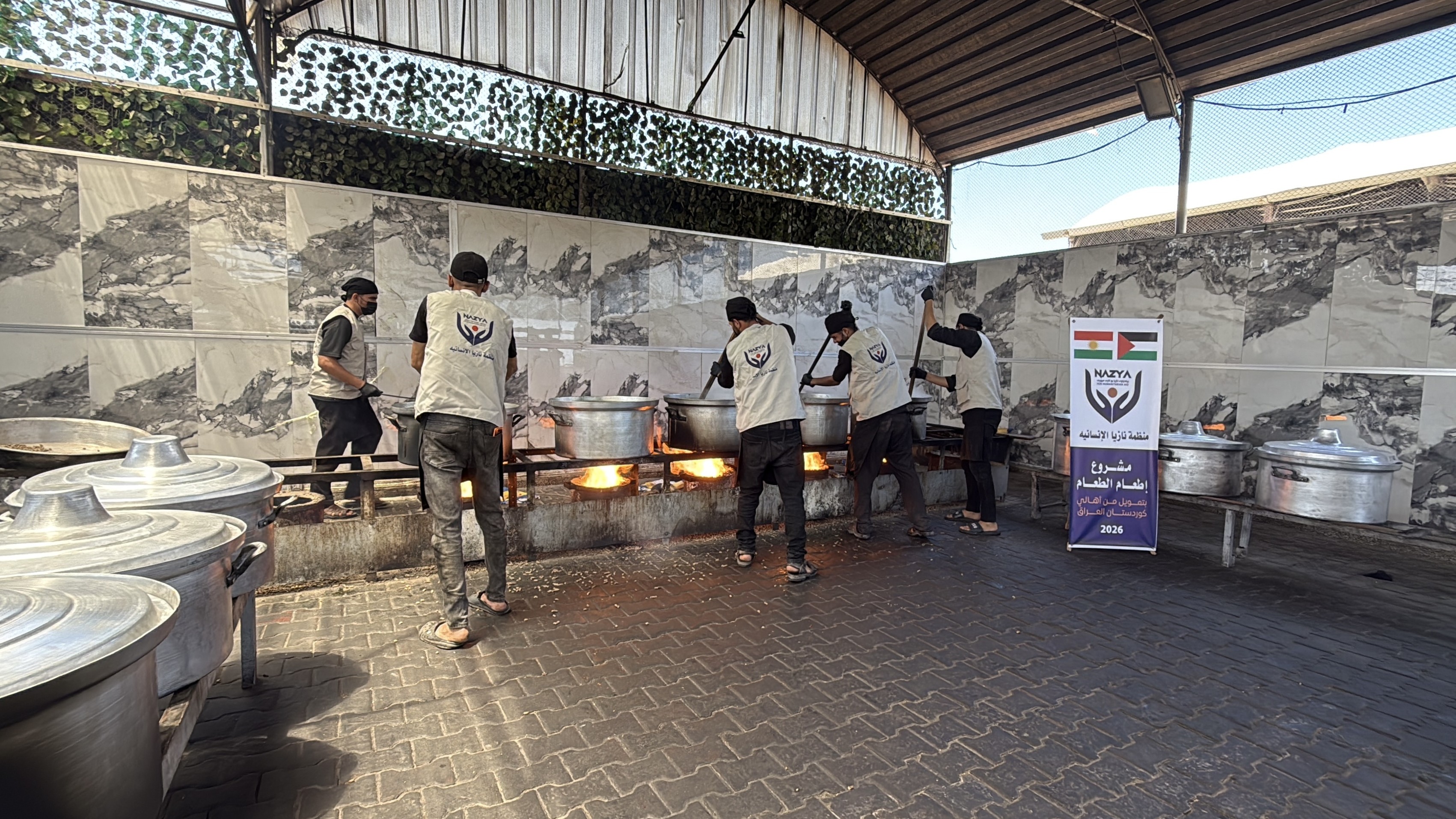Nazya Humanitarian Aid food aid distribution for Palestinian families | delivering groceries, bread and essential food supplies to people in need in Palestine