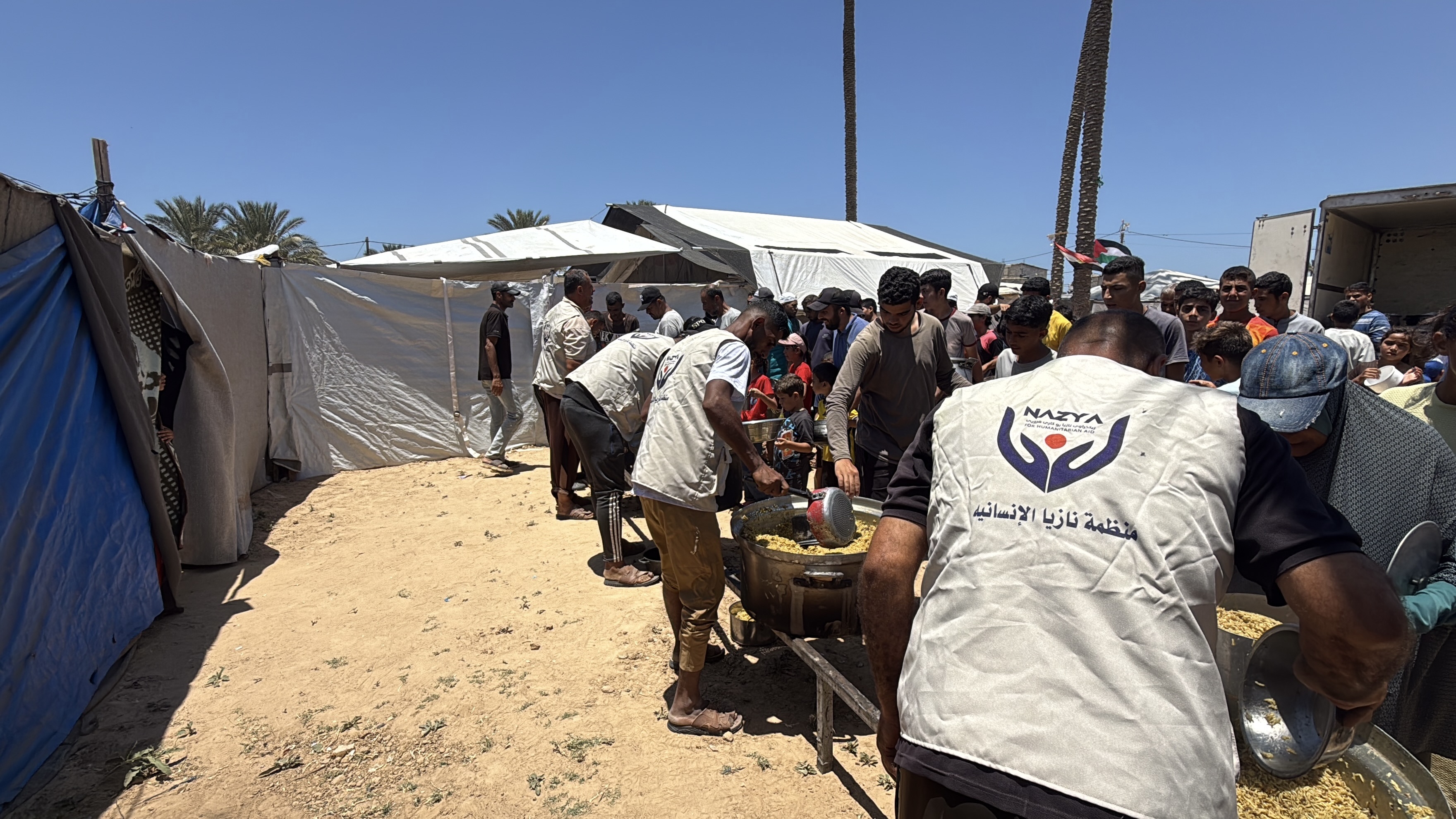 Nazya Humanitarian Aid food aid distribution for Palestinian families | delivering groceries, bread and essential food supplies to people in need in Palestine
