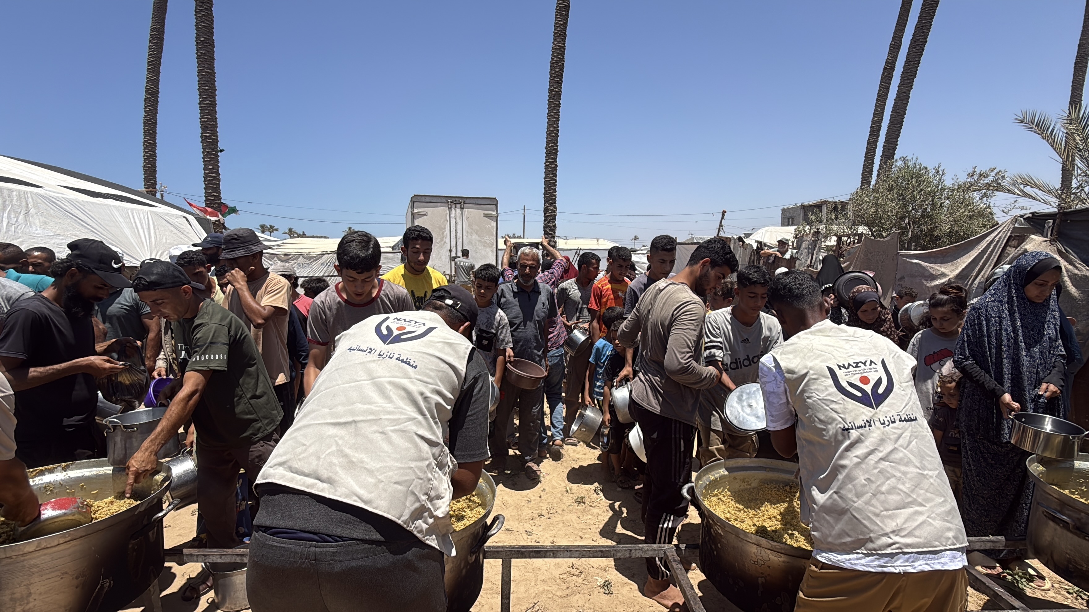 Nazya Humanitarian Aid food aid distribution for Palestinian families | delivering groceries, bread and essential food supplies to people in need in Palestine